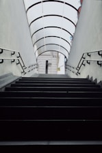 a set of stairs leading up to a skylight