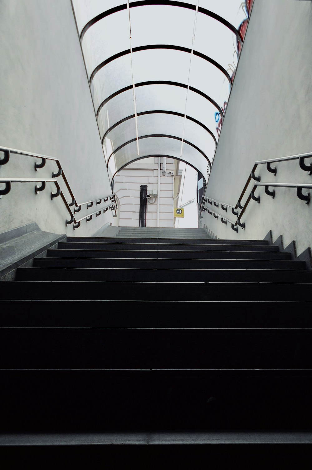 a set of stairs leading up to a skylight