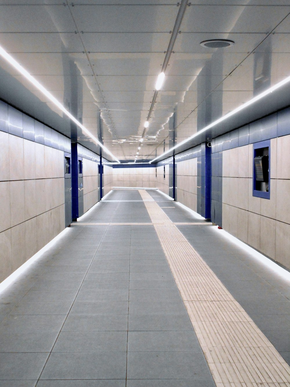 a long hallway with blue and white walls