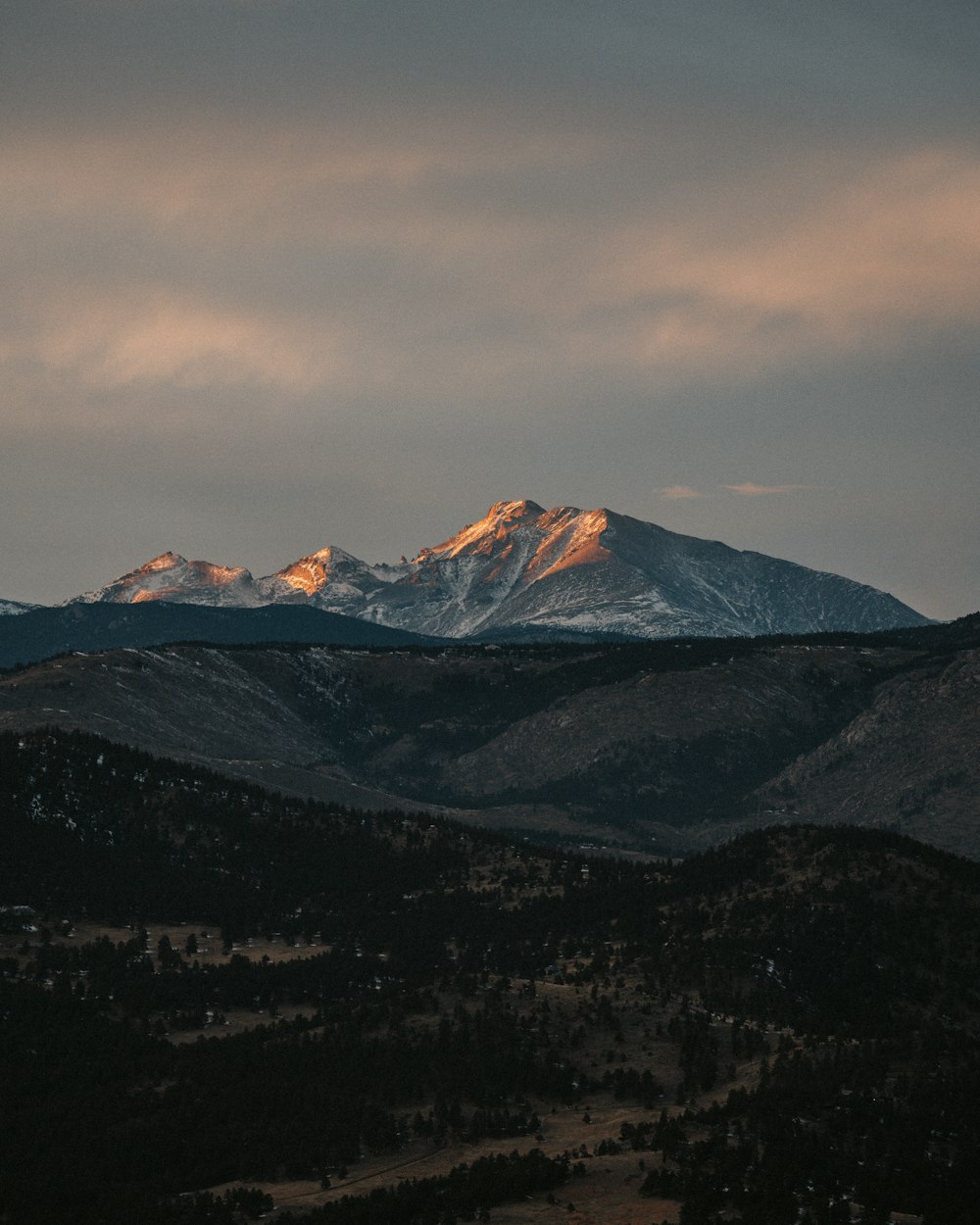 a view of a mountain range at sunset