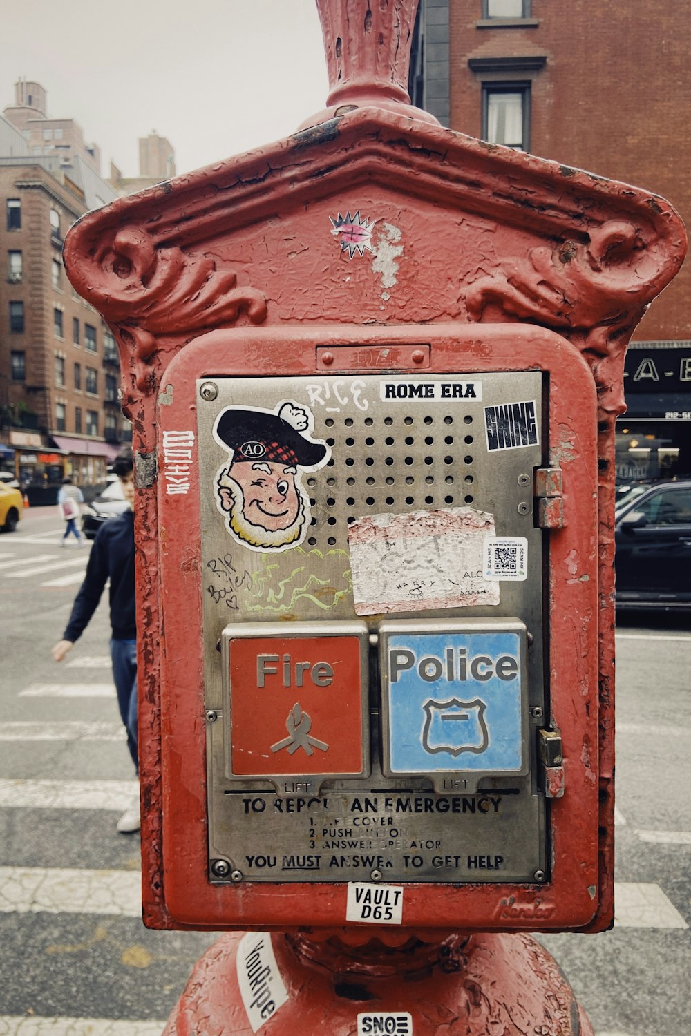 a red fire hydrant sitting on the side of a road