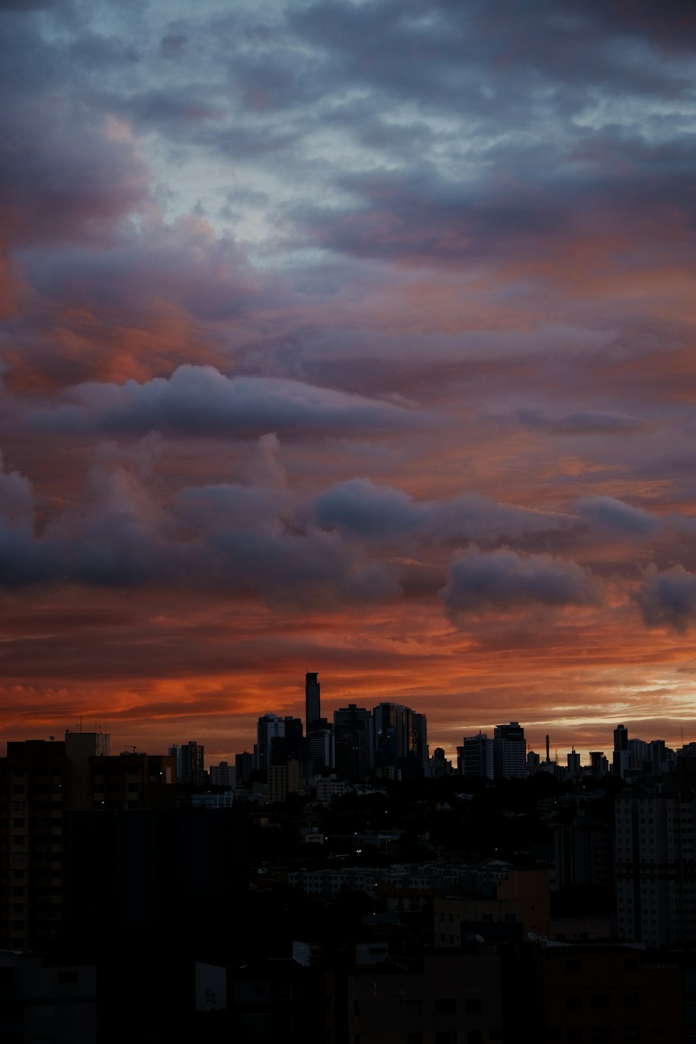 a view of a city skyline at sunset