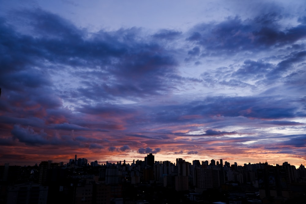 a view of a city skyline at sunset