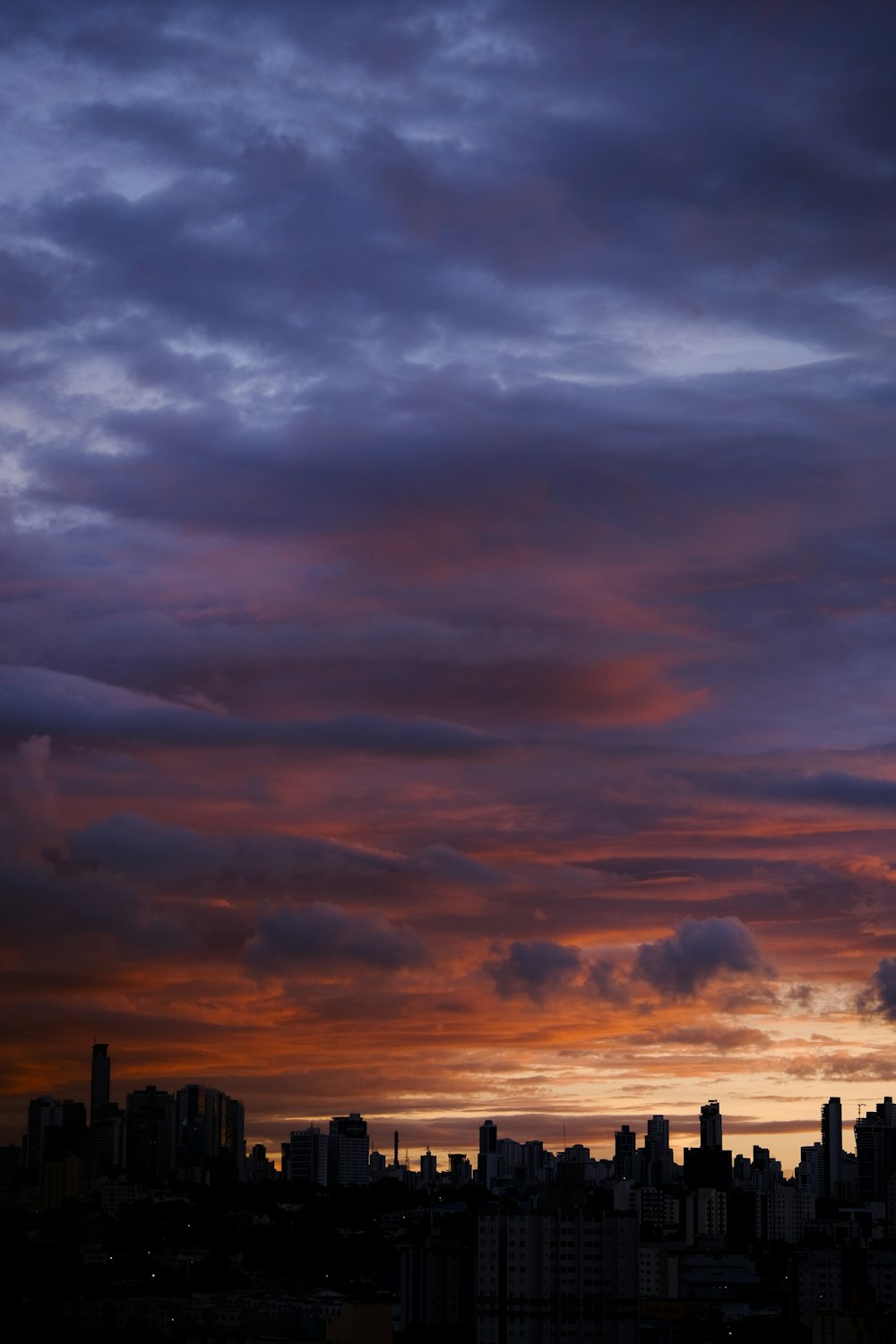 a view of a city skyline at sunset