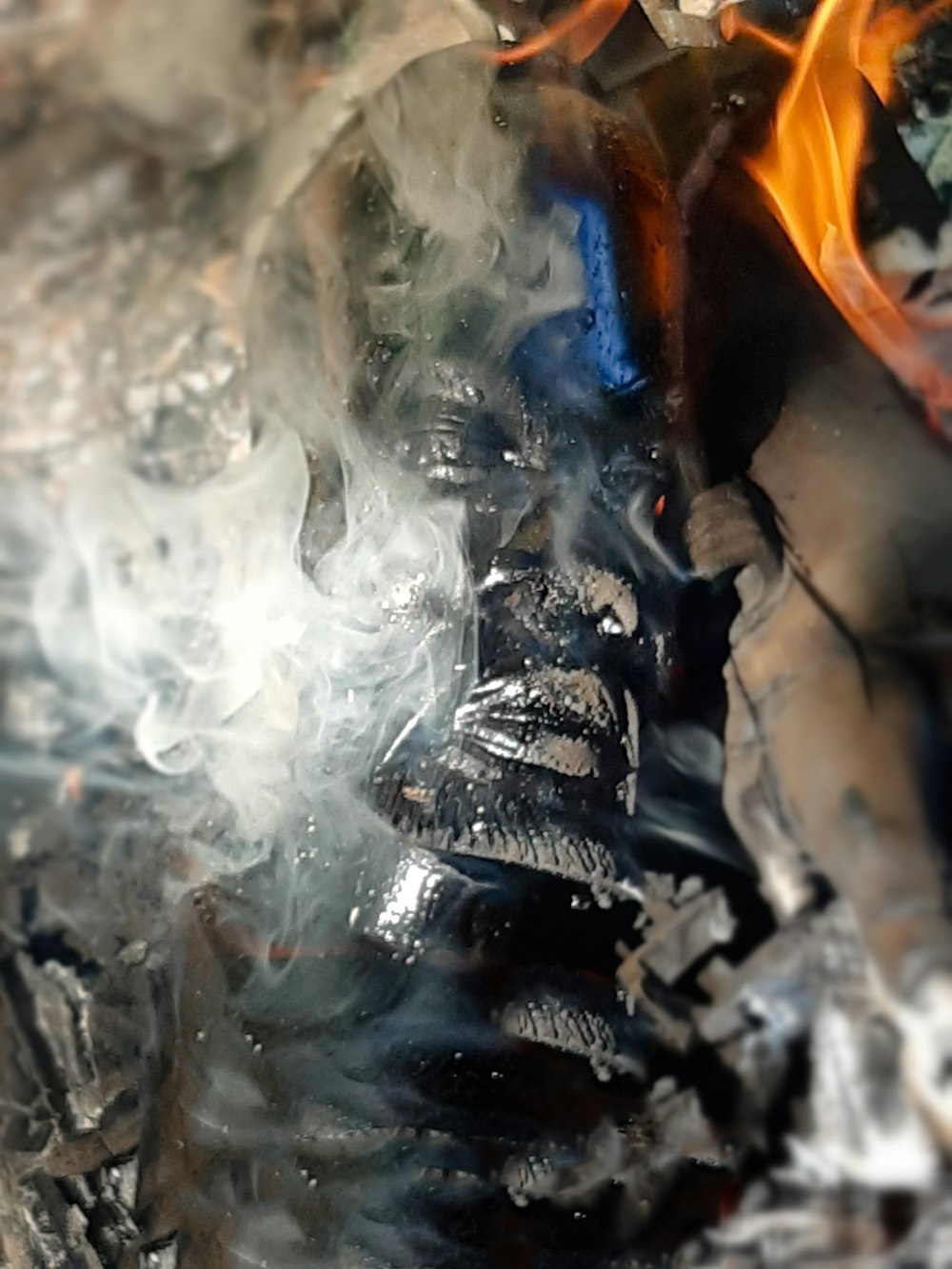 a close up of a person's face with smoke coming out of it