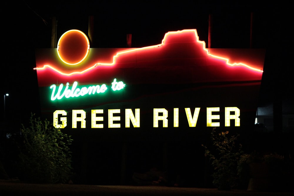 a green river sign lit up at night