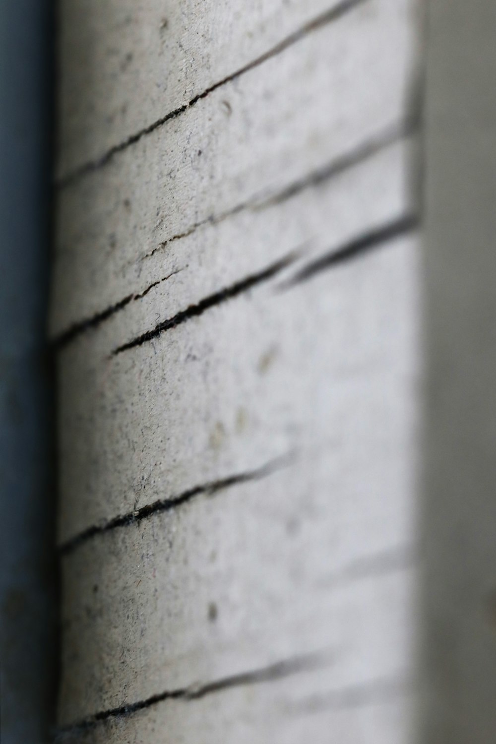 a close up of a wall with a stop sign on it