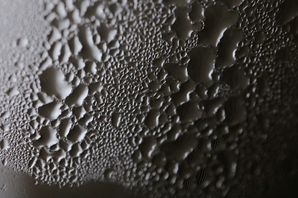 a close up of water droplets on a surface