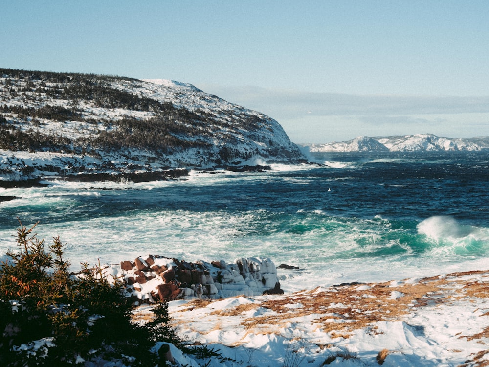 a view of a body of water with a mountain in the background