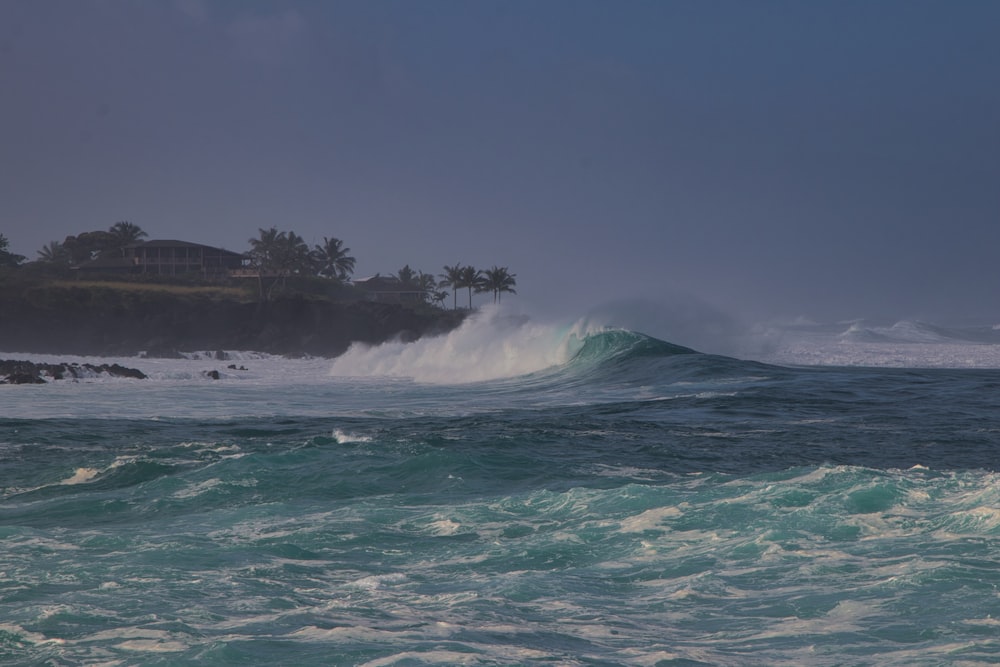 a person riding a surfboard on a wave in the ocean