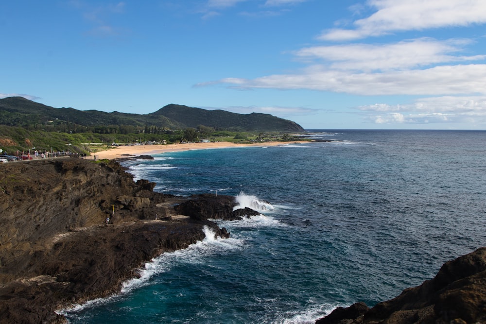 a view of the ocean and a beach from a cliff