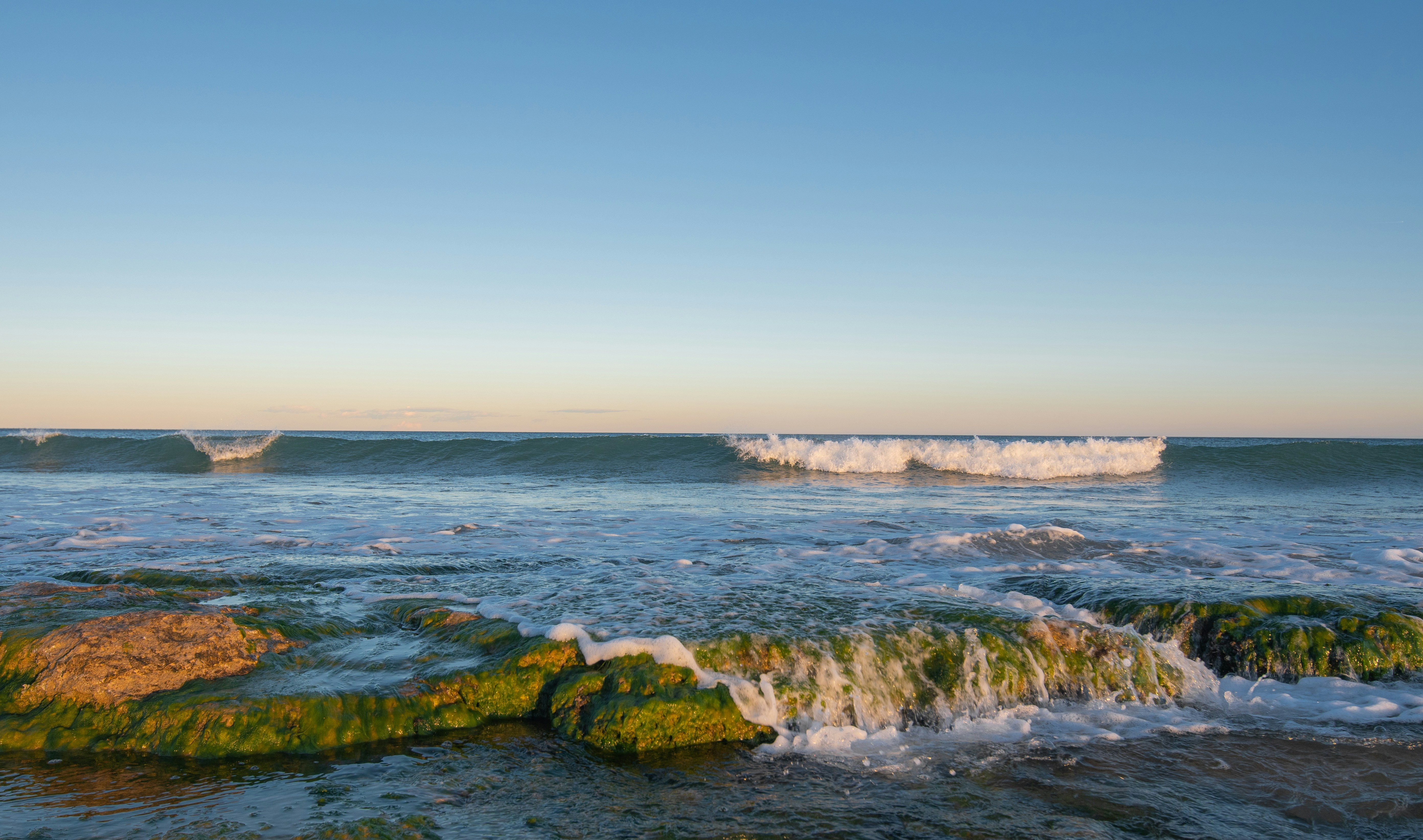 a couple of rocks that are in the water