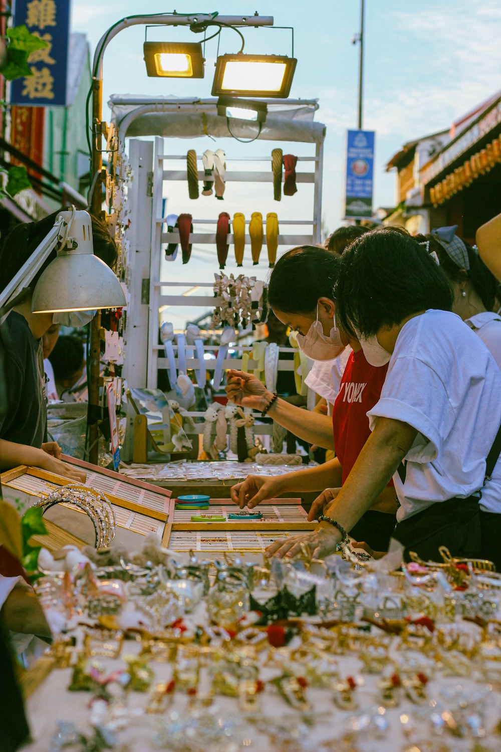 a group of people standing around a table covered in glass