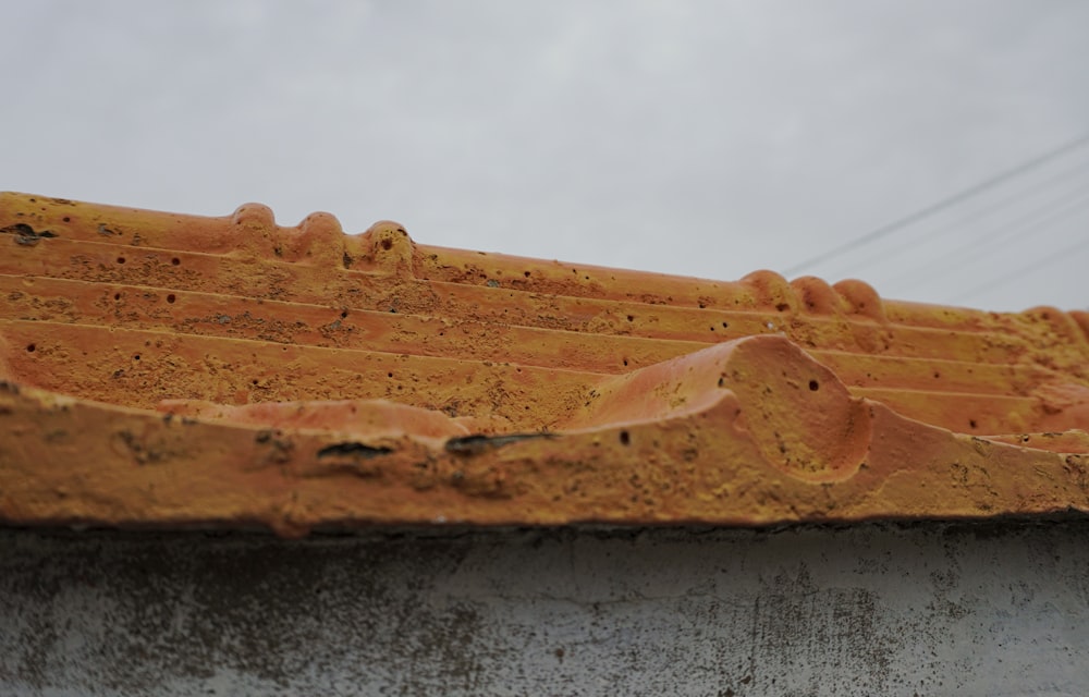 a close up of a wooden structure with a sky background