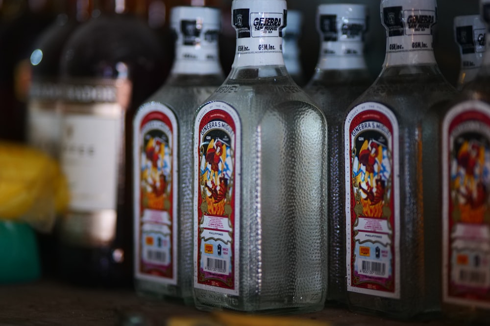 a row of bottles sitting on top of a counter