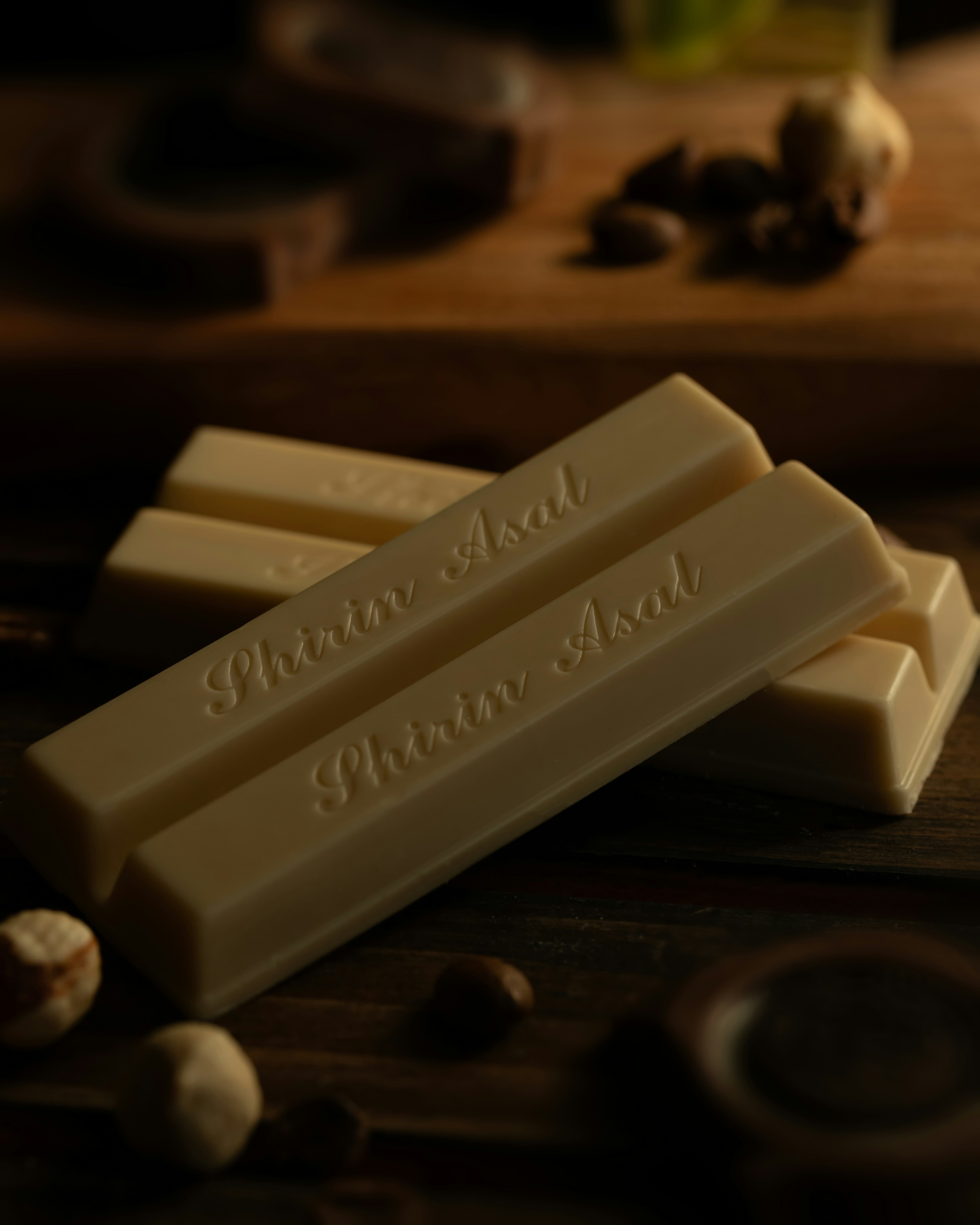 three bars of soap sitting on top of a wooden table