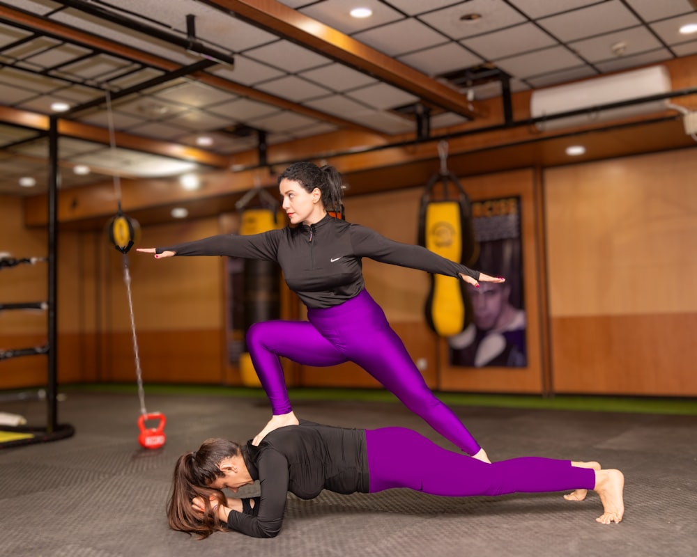 a couple of women standing on top of each other