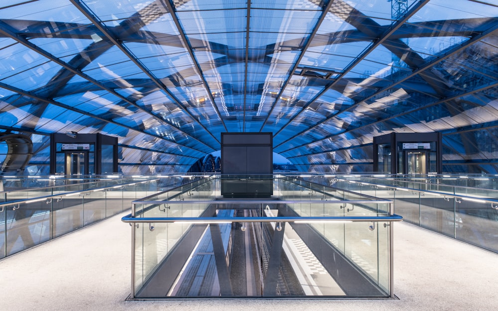 a large glass covered building with lots of windows