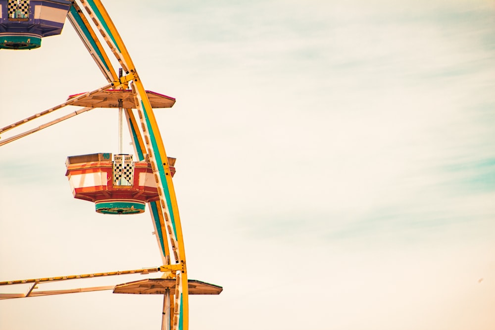 a ferris wheel is shown against a blue sky