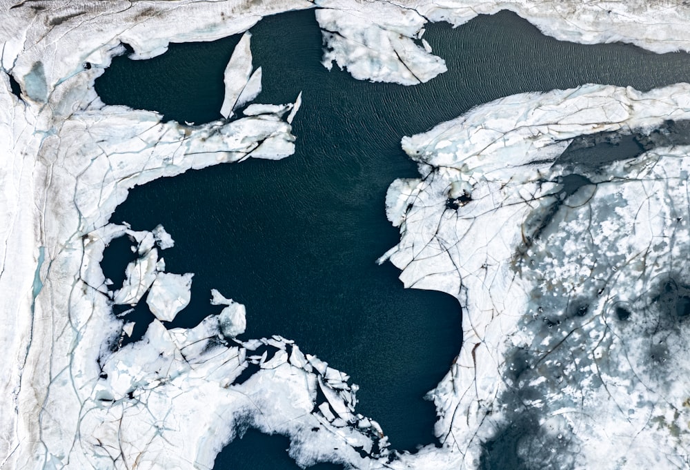 an aerial view of a large body of water covered in ice
