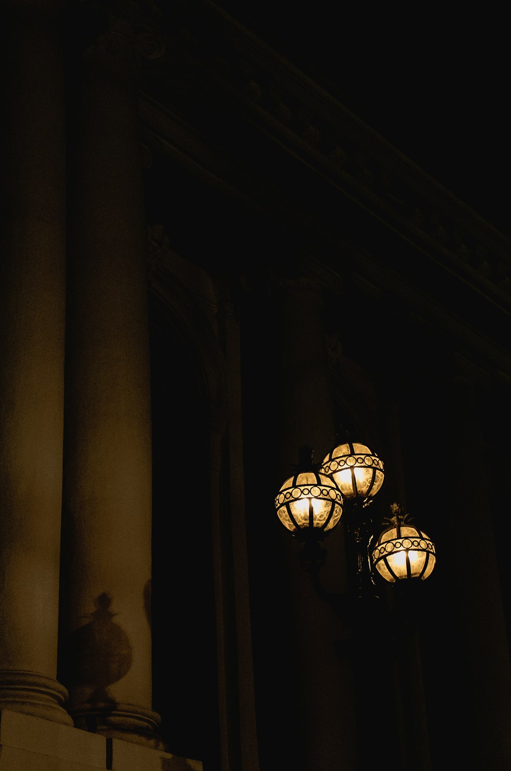 a street light is lit up in the dark