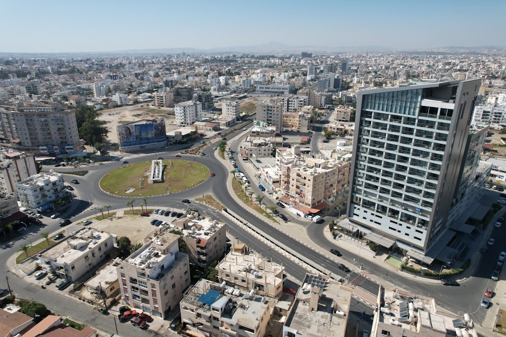 an aerial view of a city with a large building