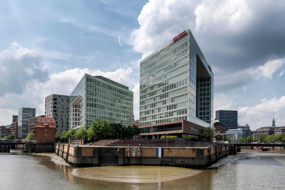 a body of water in front of a large building