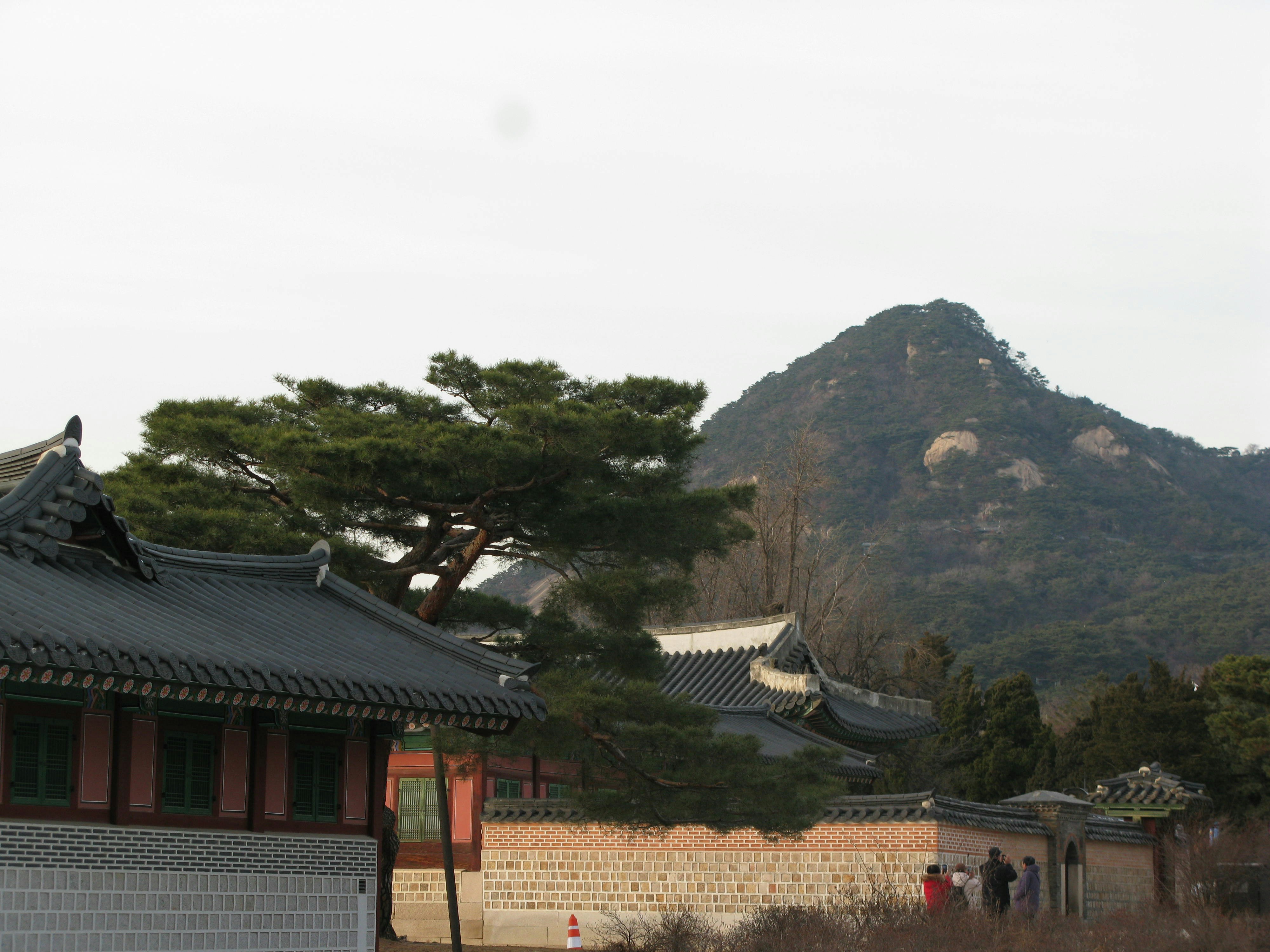 a building with a mountain in the background