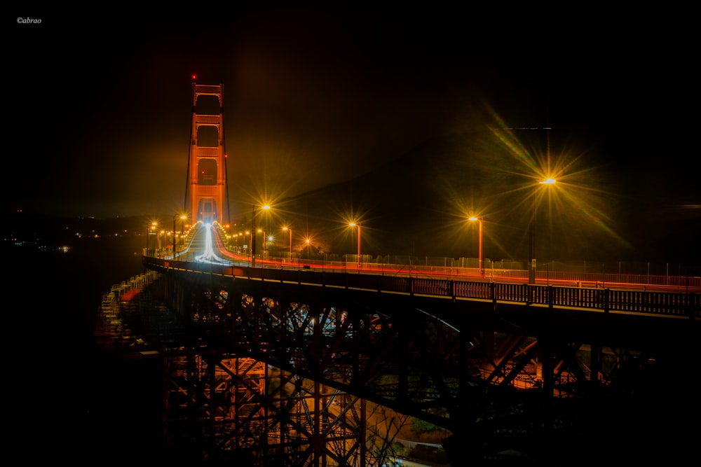 a bridge that is lit up at night