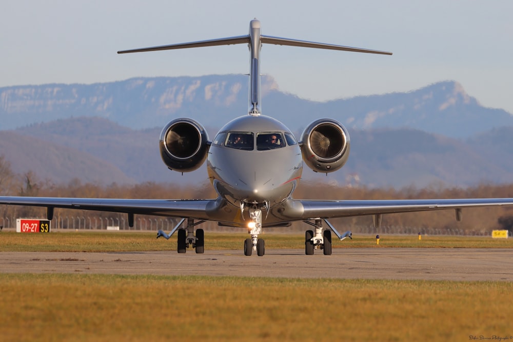 a large jetliner sitting on top of an airport runway