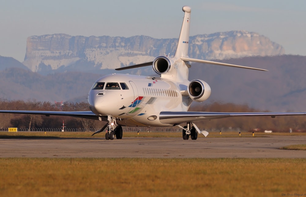 a large jetliner sitting on top of an airport runway