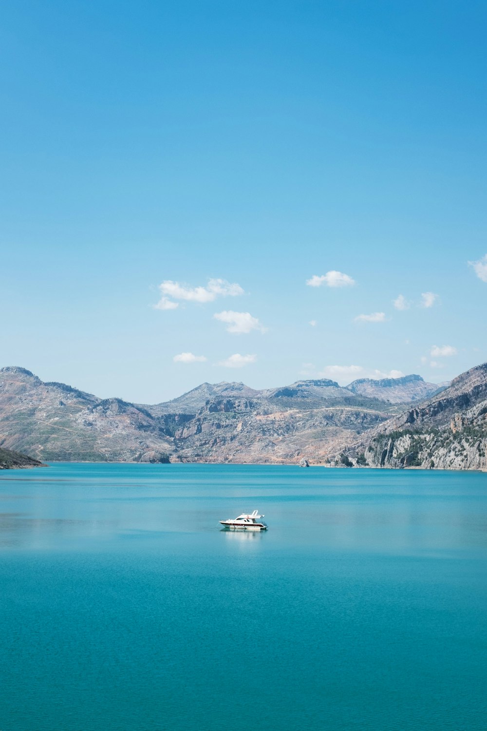 a boat floating on top of a large body of water