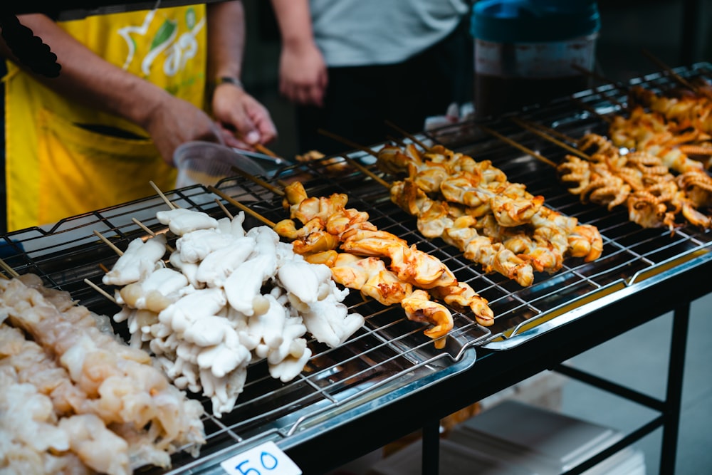 a bunch of food that is on a grill