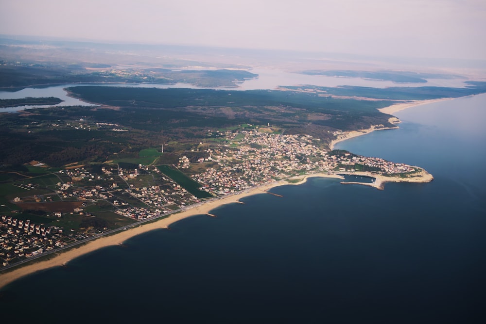 an aerial view of a city and a body of water