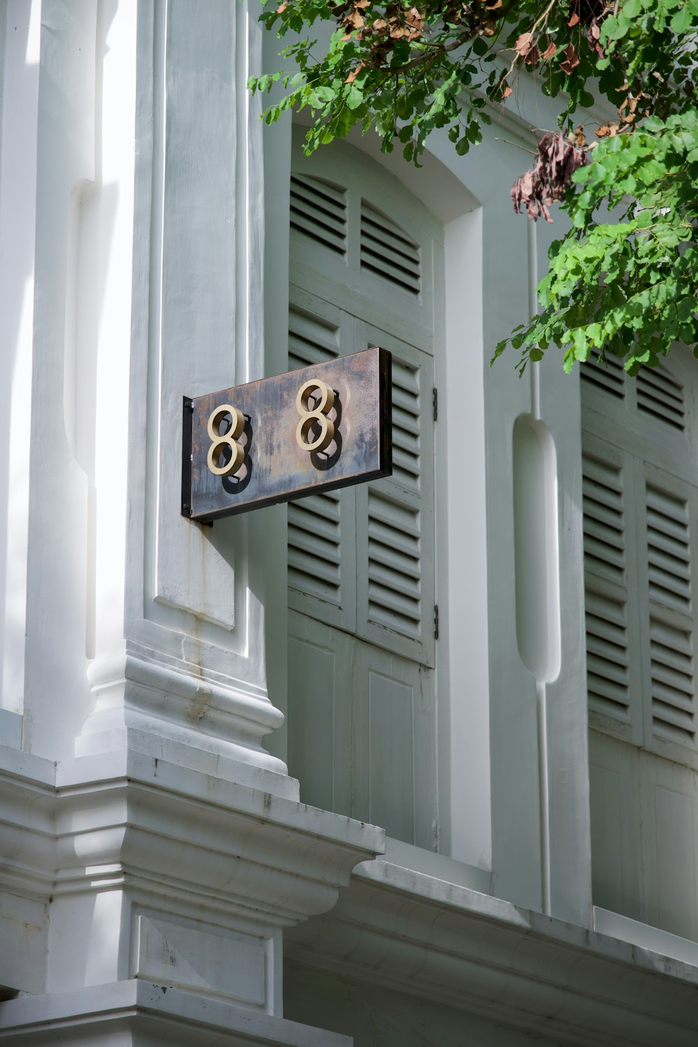 a house number sign on the side of a building