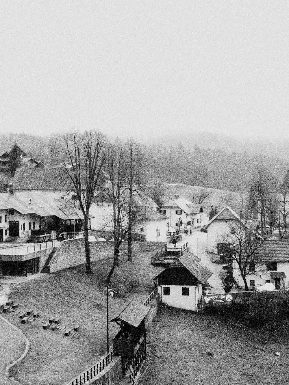 a black and white photo of a village
