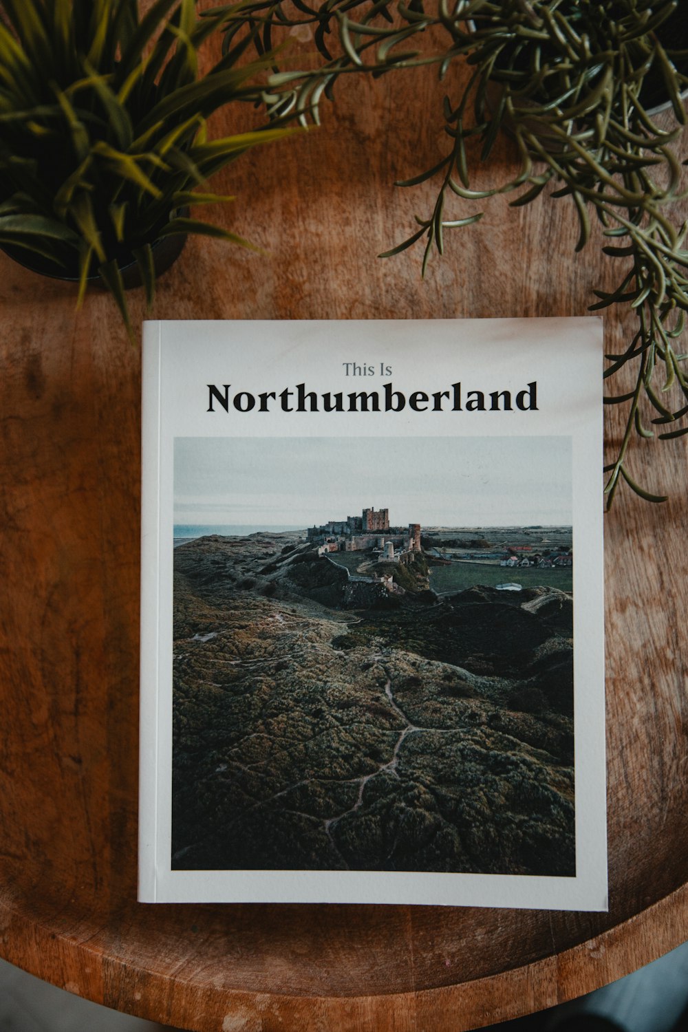 a magazine sitting on top of a wooden table