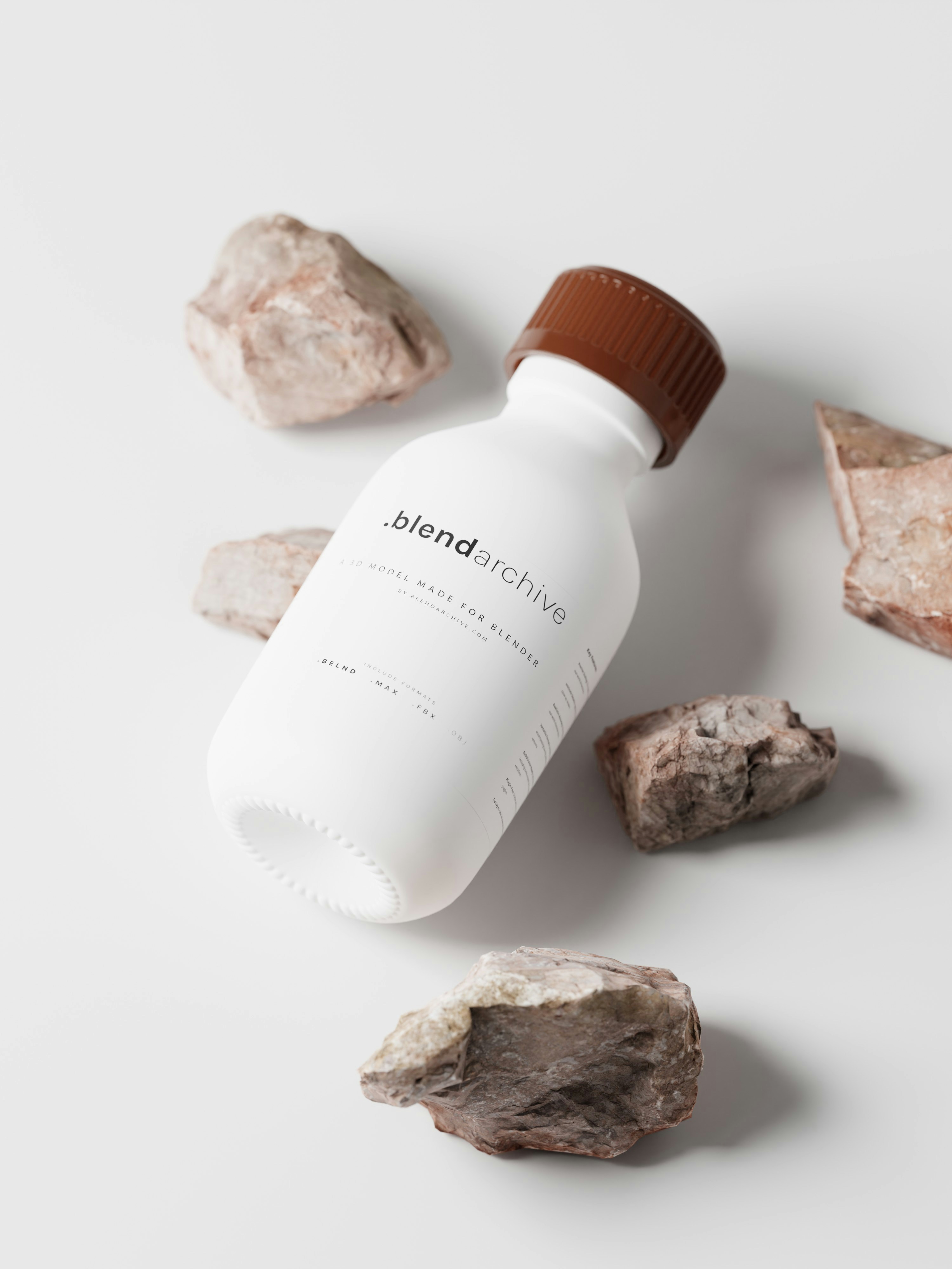 a bottle of liquid sitting next to some rocks