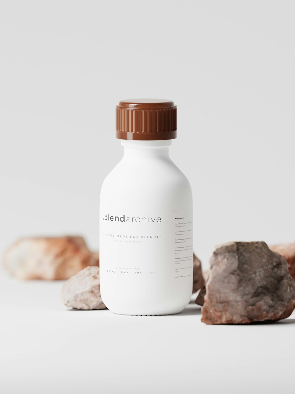a bottle of medicine sitting next to some rocks
