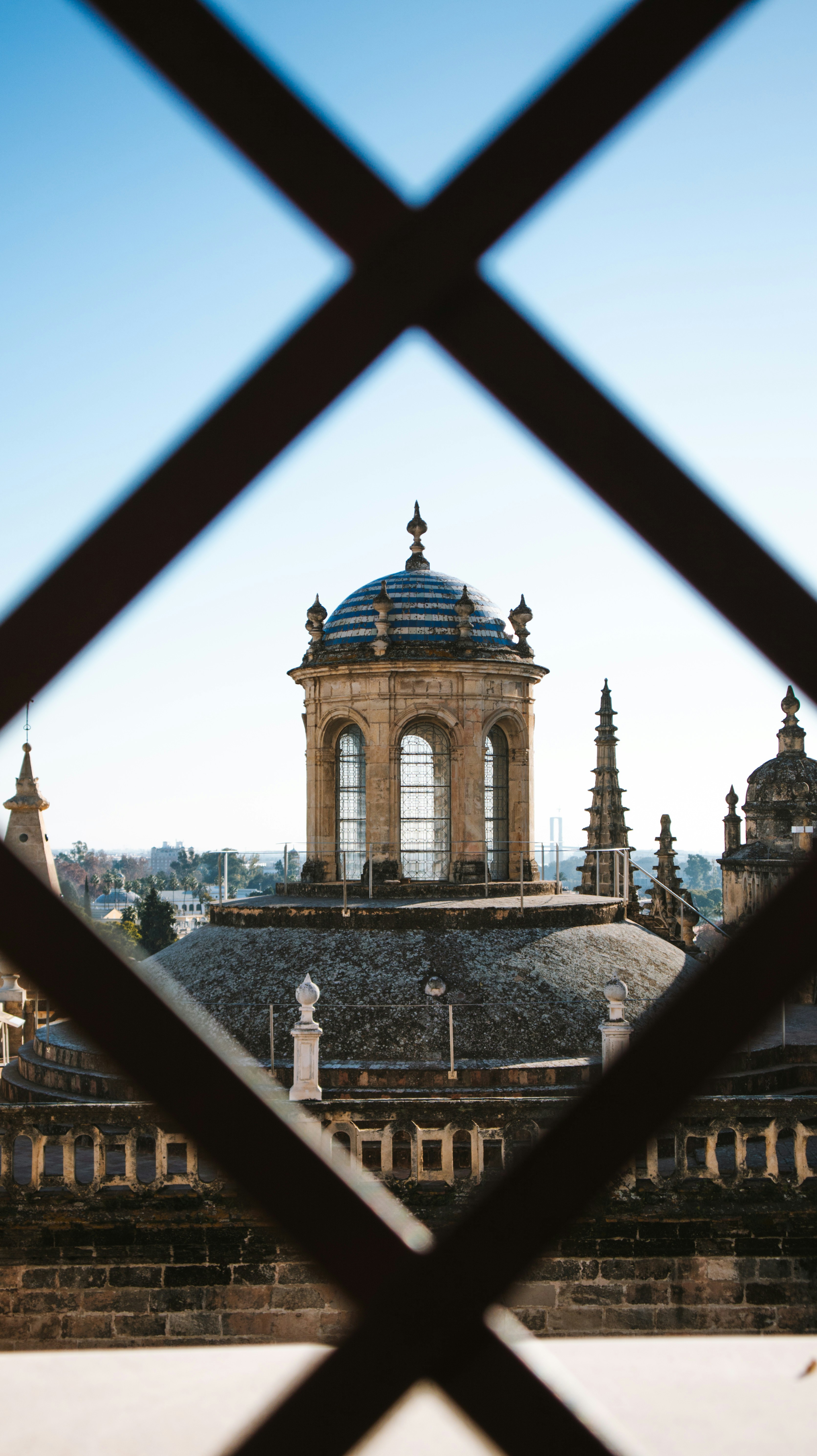 a view of a building through a fence