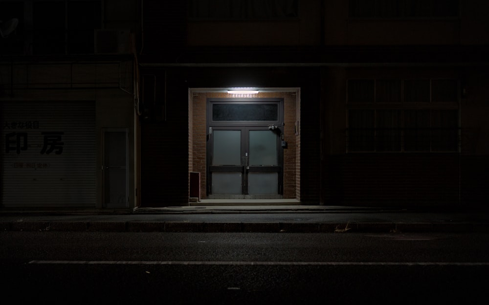 a dark room with an open door at night