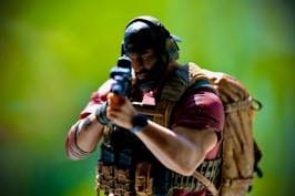 a figurine of a man holding a gun