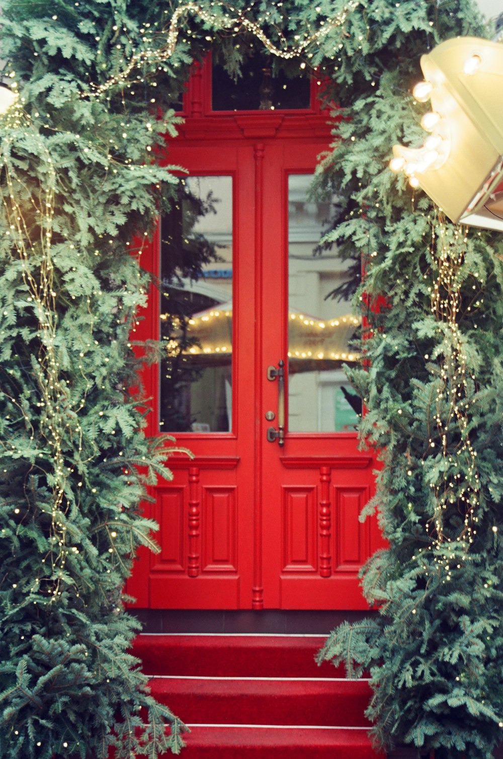 a red door with a red step leading up to it