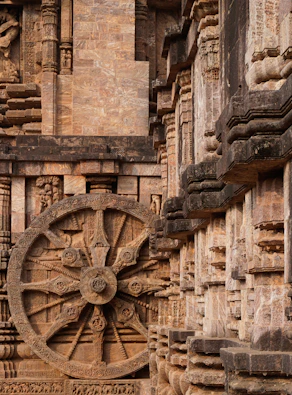 a large wheel on the side of a building