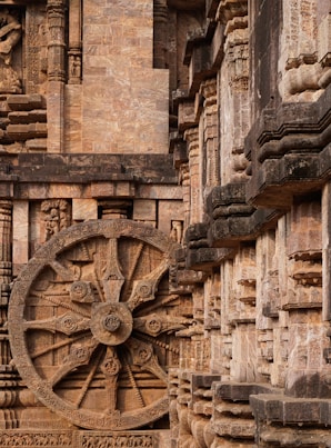 a large wheel on the side of a building