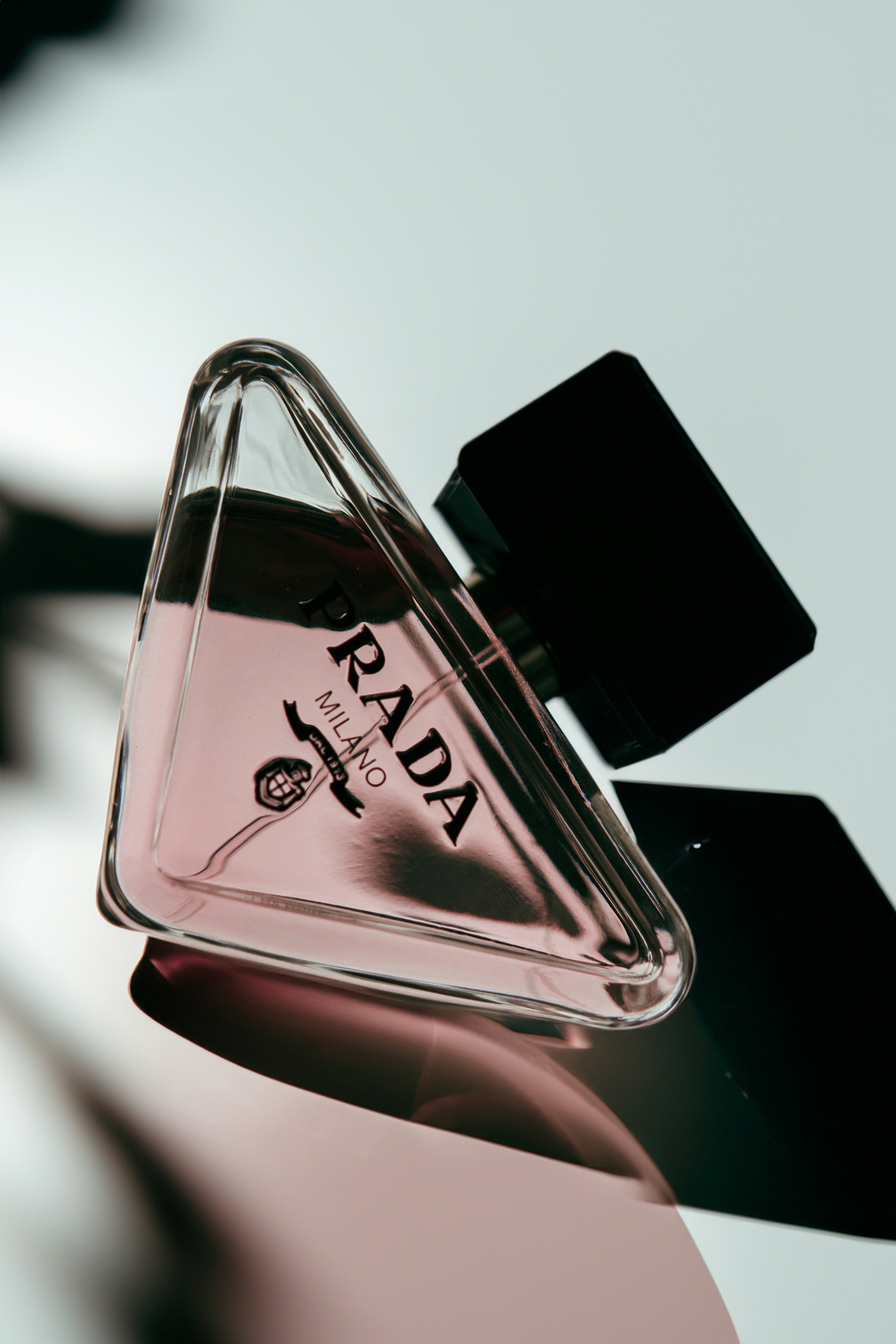 a bottle of perfume sitting on top of a table