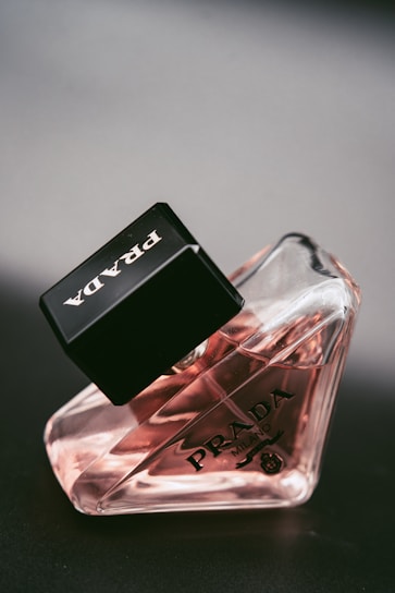 a bottle of perfume sitting on top of a table