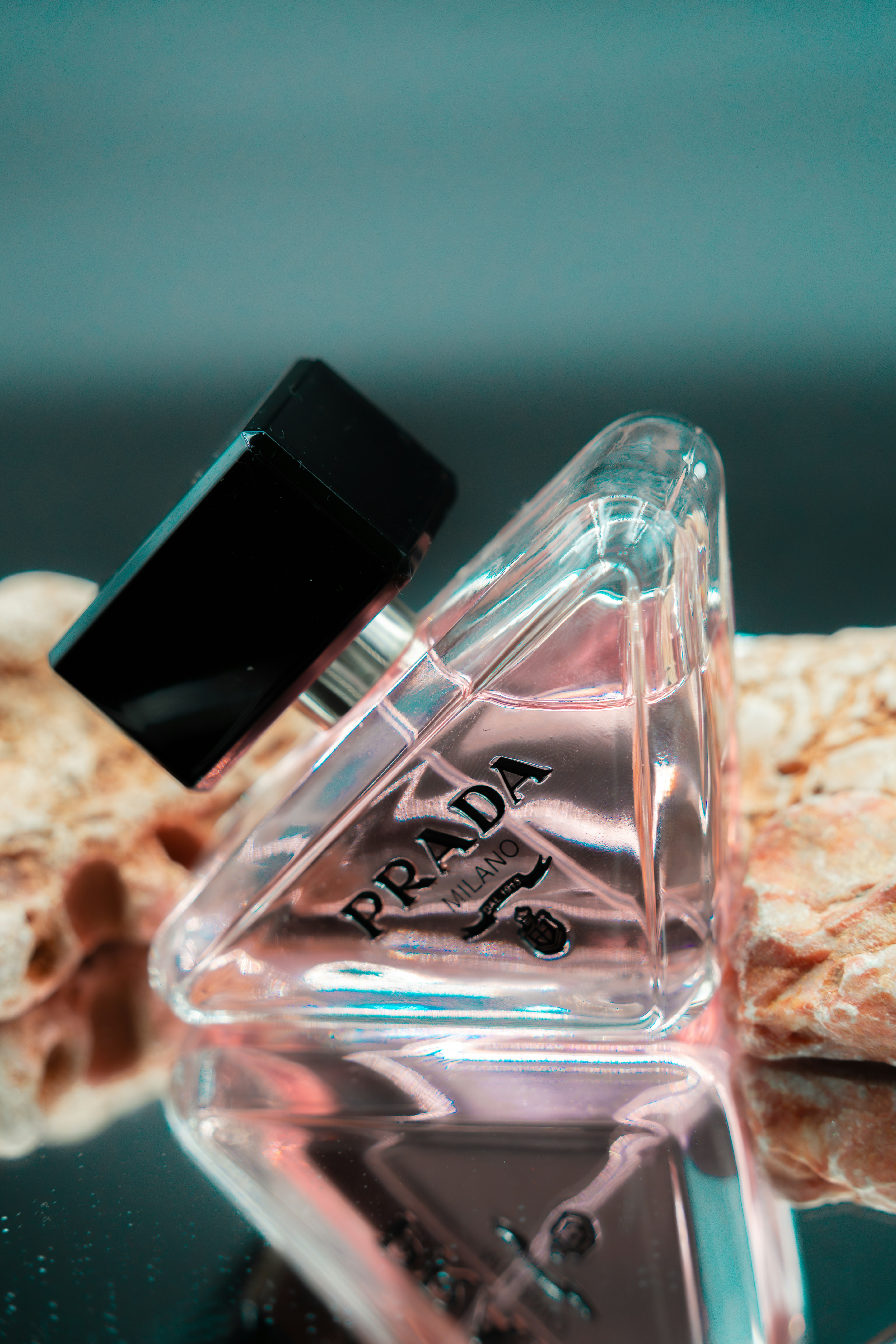 a bottle of perfume sitting on top of a table