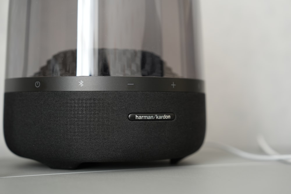 a close up of a black speaker on a table