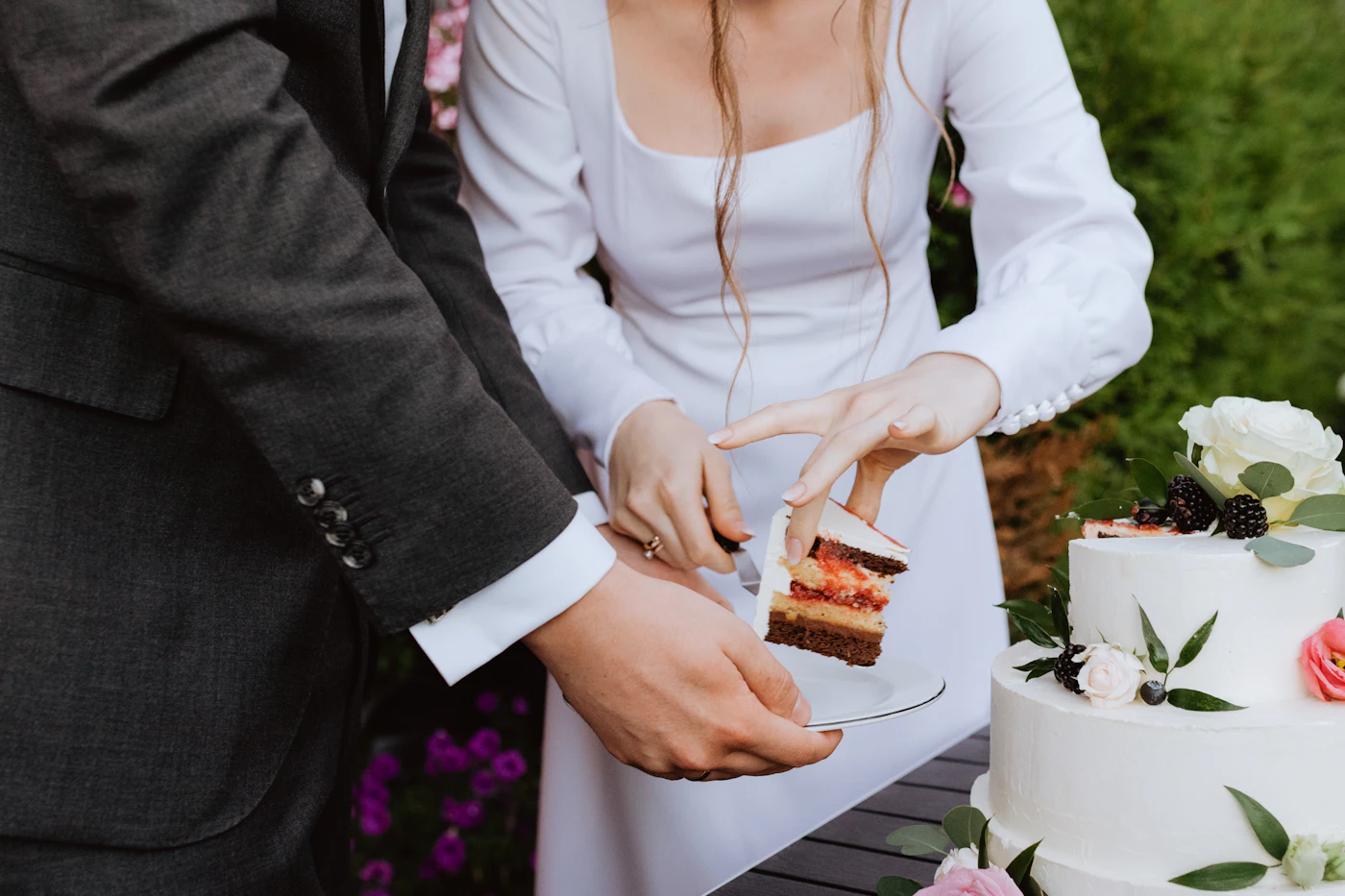 How to check wedding vendor references — A couple reviewing a vendor contract together at a table.